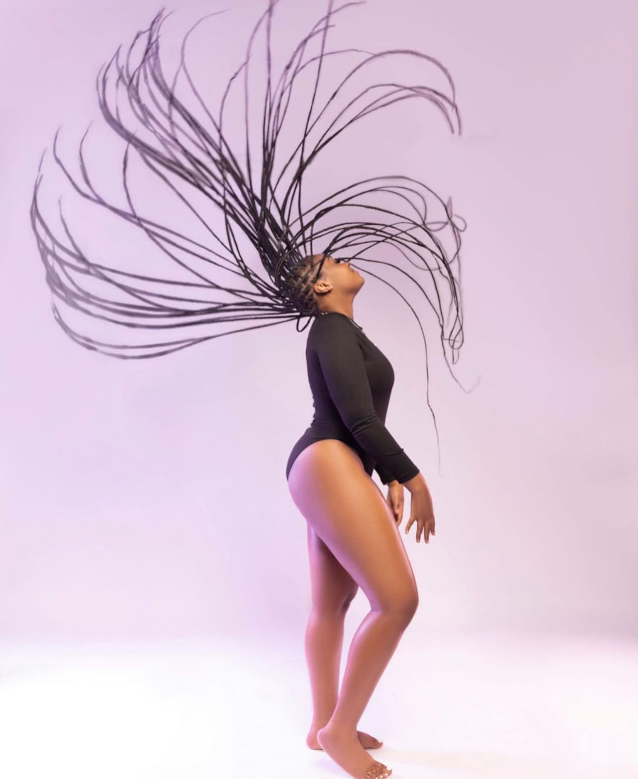 Original Oh Myah Braids photograph showing long braids in motion